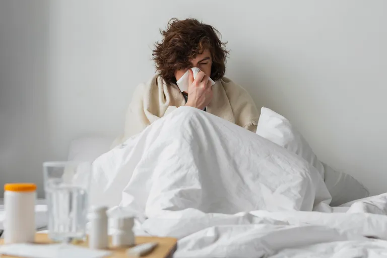 young-sick-man-staying-his-bed