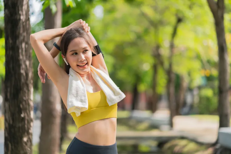 asian-cheerful-young-adult-attractive-strong-morning-stretching-before-runin-park-sports-concept-healthy-lifestyle-young-fitness-woman-runner-stretching-before-run-park