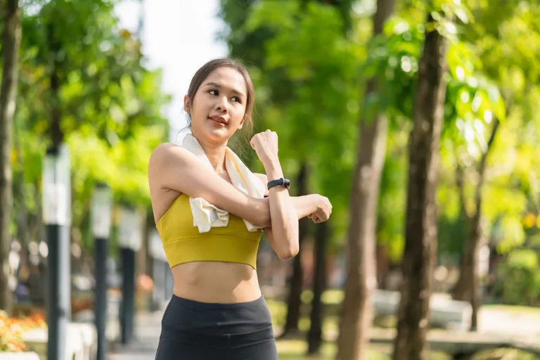 asian-cheerful-young-adult-attractive-strong-morning-stretching-before-runin-park-sports-concept-healthy-lifestyle-young-fitness-woman-runner-stretching-before-run-park
