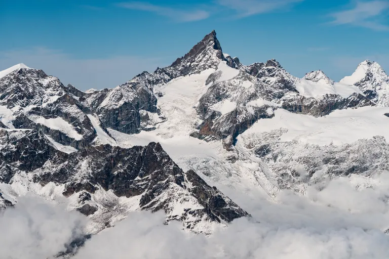 high-rocky-mountains-covered-with-snow-clear-blue-sky-switzerland