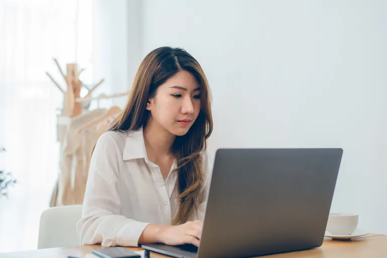 asian-woman-working-laptop-while-home-office-work-space