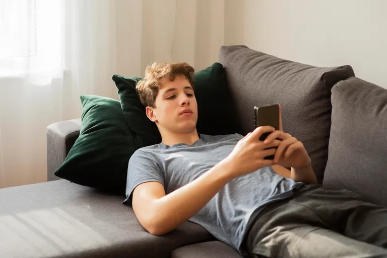 boy-checking-his-phone
