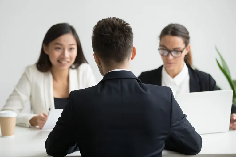 male-candidate-interviewed-by-diverse-hr-team
