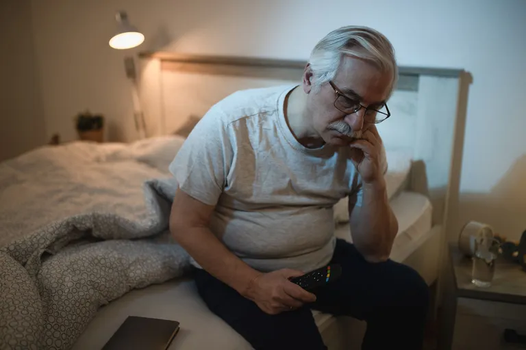 sleepless-mature-man-contemplating-while-sitting-ned-night