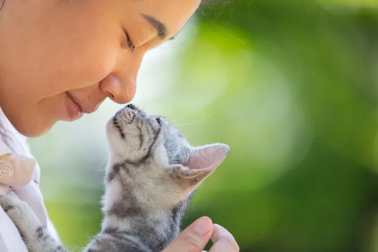 woman-hugging-cat