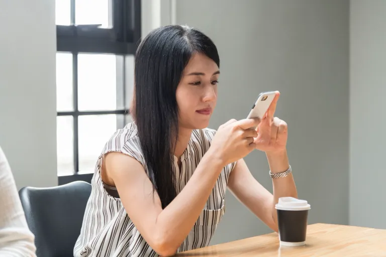 woman-playing-her-phone