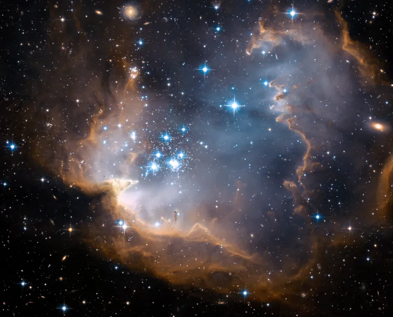 NGC_602_Comparing_Hubble_s_Webb_s_view