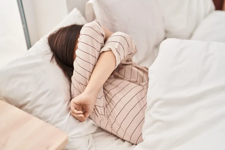 woman-stressed-bed-bedroom