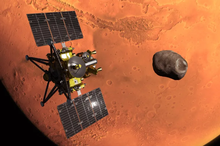 ภาพวาดของยาน MMX ที่วงโคจรของดาวอังคารกับดวงจันทร์โฟบอส ภาพจาก JAXA.png