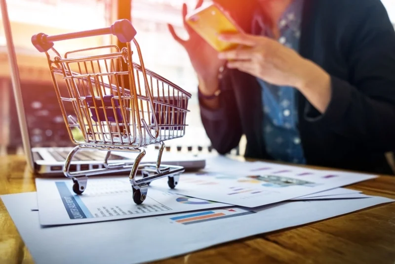 cropped-image-woman-inputting-card-information-key-phone-laptop-while-shopping-online.jpg