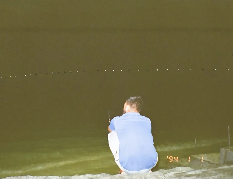 A man came to the artificial beach, talking on the phone. (Photo: Peerachai Pasutan)