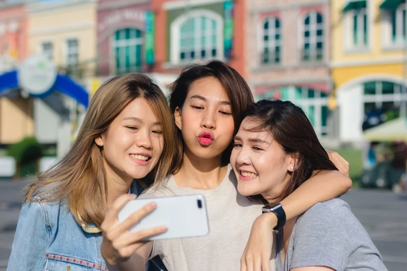 attractive-beautiful-asian-friends-women-using-smartphone