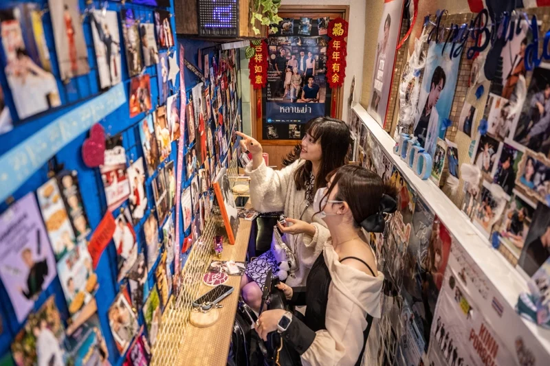 A Thai-theme cafe in Tokyo decorated with posters of BL series and actors (Photo: Yuichi Yamazaki/AFP)