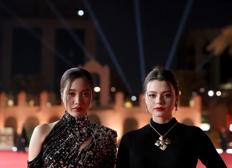 Sarocha "Freen" Chankimha (L) and Rebecca Patricia Armstrong in December 2024 (Photo: Patrick Baz/Factstory for the Red Sea International Festival/AFP)