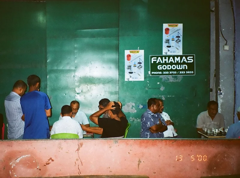 A group of Mal&eacute; residents were hanging out late at night. (Photo: Peerachai Pasutan)