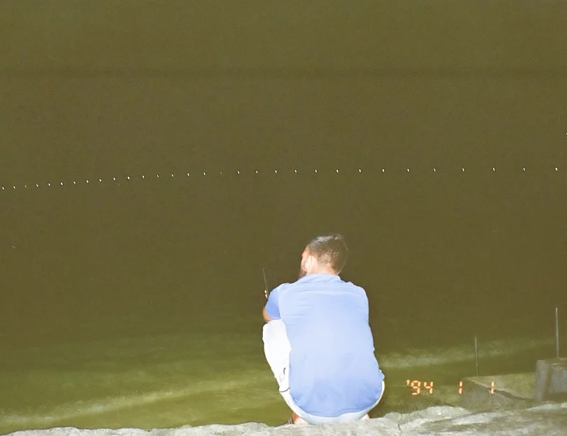 A man came to the artificial beach, talking on the phone. (Photo: Peerachai Pasutan)